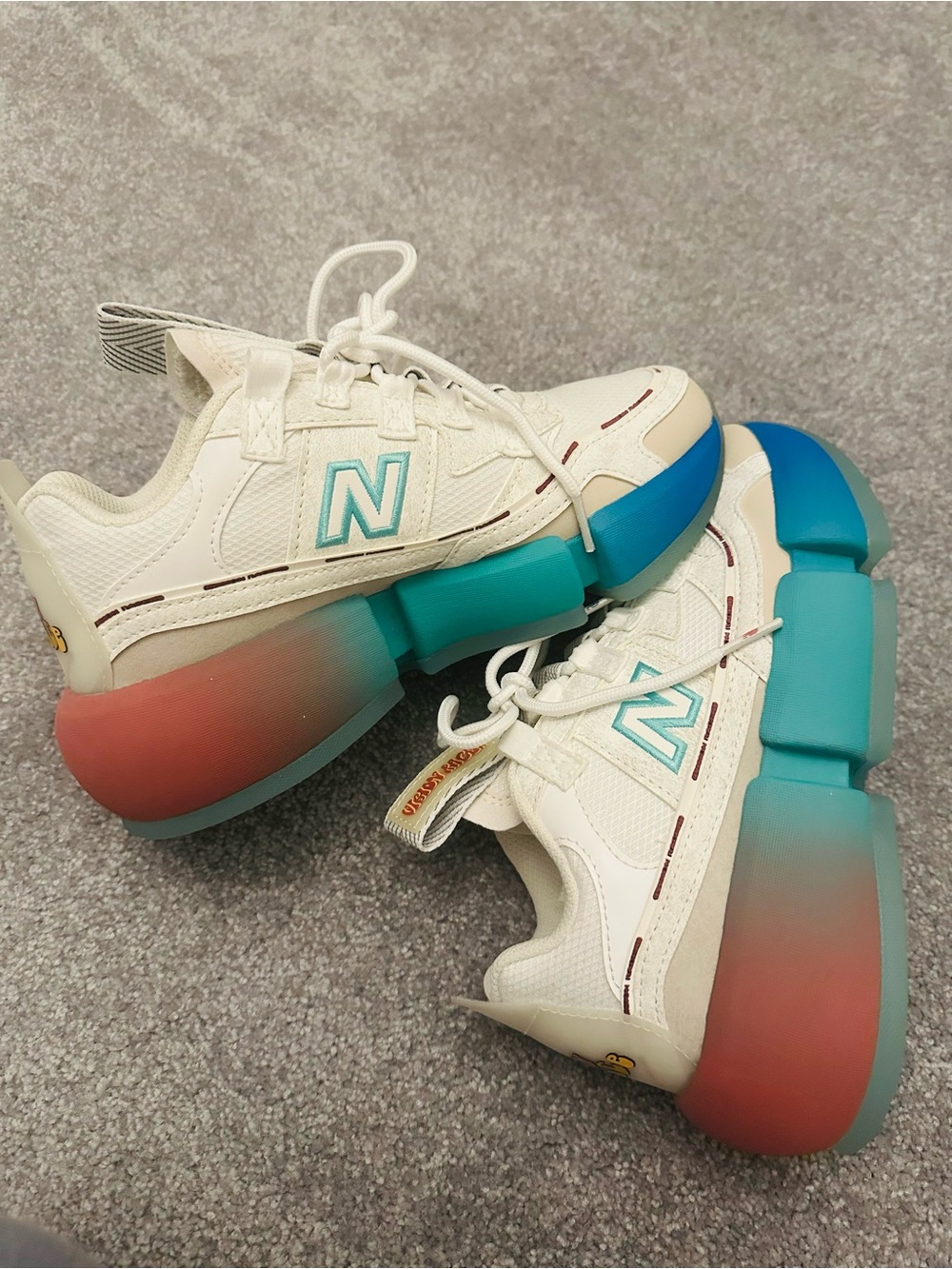 New Balance White Sneakers with Teal and Gradient Blue-Pink Sole